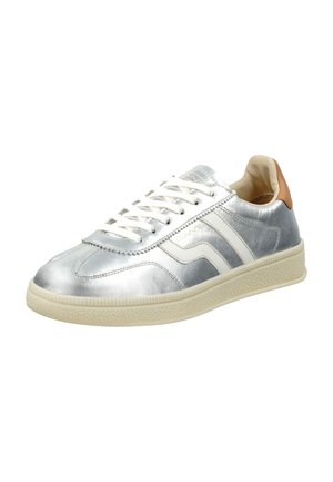 Silver metallic sneaker with white accents and cream rubber sole. Features round toe, lace-up front, and brown leather heel tab.
