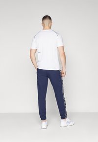 Lacoste Sport TROUSERS TAPE - Treniņtērpa apakšdaļas - navy blue