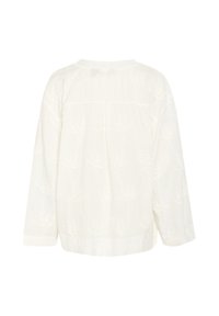 Blusa bianca a maniche lunghe con delicata ricamo floreale, scollatura rotonda e vestibilità rilassata con dettaglio plissettato sul retro.