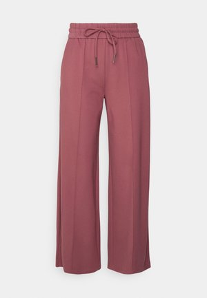 Pantalones de pierna ancha en un color rosa apagado. Presentan una cinturilla elástica con cordón, hechos de una tela suave y texturada.