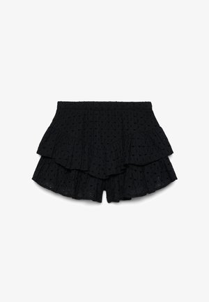 Short noir taille haute en tissu ajouré, ourlet superposé à volants et taille élastique, conçu pour un usage décontracté.