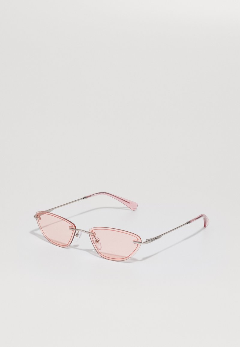 Cat-eye sunglasses with transparent pink lenses, metallic silver frame, and slender arms. Features minimalistic design and adjustable nose pads.