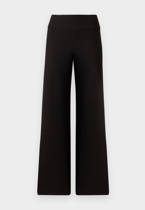Pantalons larges noirs avec une taille lisse, fabriqués dans un matériau doux. Présentent une coupe ample et des détails de couture minimaux.