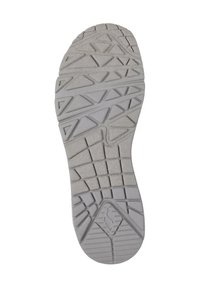 Gray rubber shoe sole featuring a textured, zigzag pattern with triangular grooves and a rounded toe for enhanced traction.