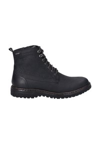 Botas de cuero negro hasta el tobillo con una superficie texturizada, diseño con cordones y suela de goma con un patrón de banda de rodadura.