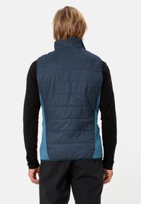 Gilet imbottito blu navy con colletto alto, caratterizzato da un pannello laterale a contrasto azzurro, texture trapuntata e forma aderente.