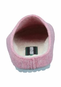 Pink felt slipper with a soft inner lining, rounded shape, and a white rubber sole; features a label on the insole.