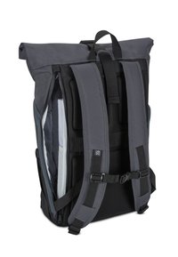 Gray waterproof backpack with a roll-top design, mesh straps, multiple compartments, and adjustable hardware for secure carrying.