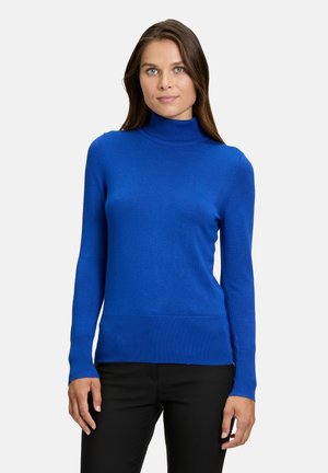Blauer Rollkragenpullover aus einem glatten Material. Lange Ärmel mit einer taillierten Passform, ausgestattet mit einem gerippten Kragen und Saum.