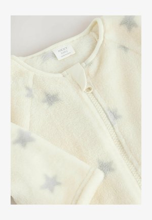 Kreemivärvi fliisist beebihõlmik, millel on lukuga sulgemine, hallide hajusate tähtede mustriga ja ribadega krae. Pehme, tekstureeritud kangas.