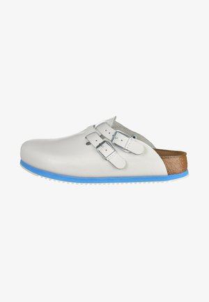 White leather clogs with two adjustable silver buckles, light blue sole, and brown textured footbed. Features a rounded toe and slip-on design.