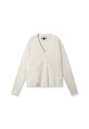 Crème v-hals trui met lange mouwen, gemaakt van zacht materiaal. Heeft een cropped ontwerp en een klein labelaccent aan de linksonderzijde.