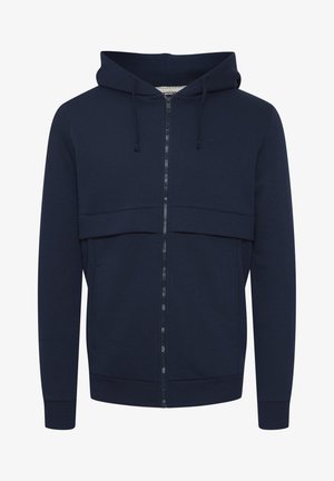 Granatowa bluza rozpinana z miękkiego materiału, z kapturem na sznurku, kieszeniami z przodu i ściągaczami przy rękawach. Prosty design z delikatnym logo.