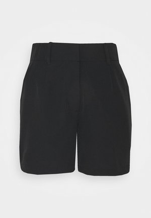 Musta, korkeat vyötäröshortsit, joissa on vyölenkit, edessä laskokset ja siisti helmaviiva valkoisella taustalla.