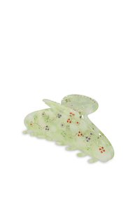 Pince à cheveux verte translucide avec des motifs floraux, ornée de strass multicolores. Elle possède des bords courbés et plusieurs griffes de maintien.