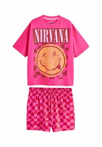 Felle roze short-sleeve shirt met de tekst "NIRVANA" en een glimlachende gezicht graphic, gecombineerd met roze geblokte shorts met elastische taille.