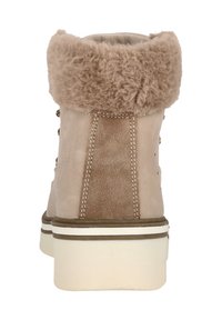 Bottes de cheville en suède beige avec un col en fausse fourrure douce et tan, semelle en caoutchouc blanche et couture décorative à l'arrière et sur le panneau latéral.