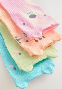 Four pairs of ribbed socks in pastel colors: pink, orange, green, and blue. Each features distinct animal faces and playful accents.