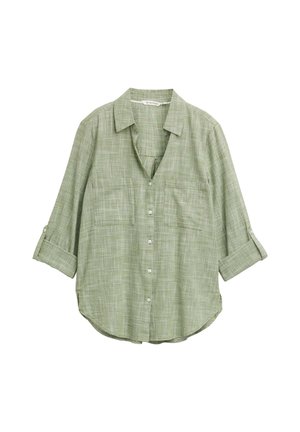 Camicia a quadri verdi con colletto, due tasche frontali e maniche arrotolate. Realizzata in tessuto leggero con vestibilità ampia.