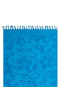 Asciugamano da spiaggia in cotone blu con motivi floreali e bordi frangiati, che presenta la parola "SUNDEK" tessuta nel design.