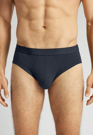 Dunkelgraue Slips aus glattem Stoff mit nahtlosem Bund, ausgestattet mit einem unterstützenden Frontpouch und einem figurbetonten Design.