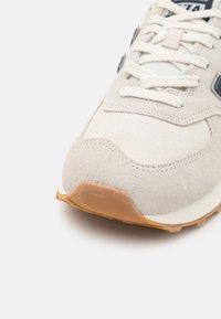 New Balance 574 UNISEX - Sneakers - off-white/dark blue