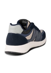 Navy blue sneaker with suede and mesh panels, light gray accents, perforated details, and a white speckled sole for grip.