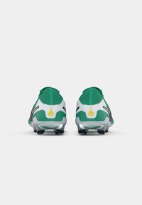 Green football cleats featuring a sleek design, black accents, textured upper, and a yellow logo detail at the heel.