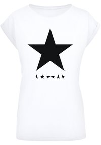 White cotton T-shirt with rolled sleeves featuring a large black star graphic and smaller star shapes below in various sizes.