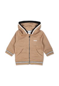 Haut à capuche zippé beige avec des accents rayés noirs et blancs, deux poches avant et une capuche. Présente le logo "BOSS" sur la poitrine.