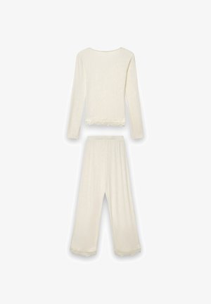 Completo composto da top a maniche lunghe crema a coste e pantaloni a gamba larga con bordo in pizzo all'orlo, mostrato disteso su uno sfondo bianco.