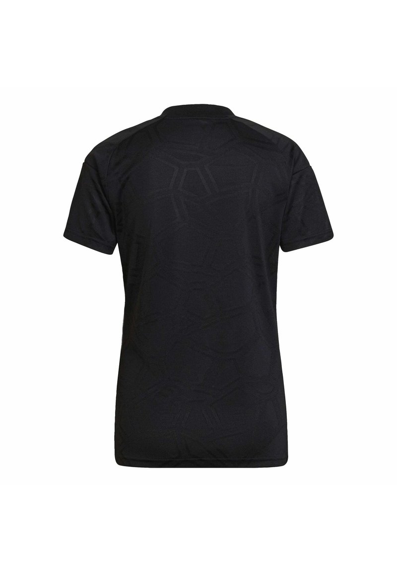 Camisa negra de manga corta con un patrón hexagonal texturizado, con un escote redondo y una tela suave. Se muestra la vista posterior.