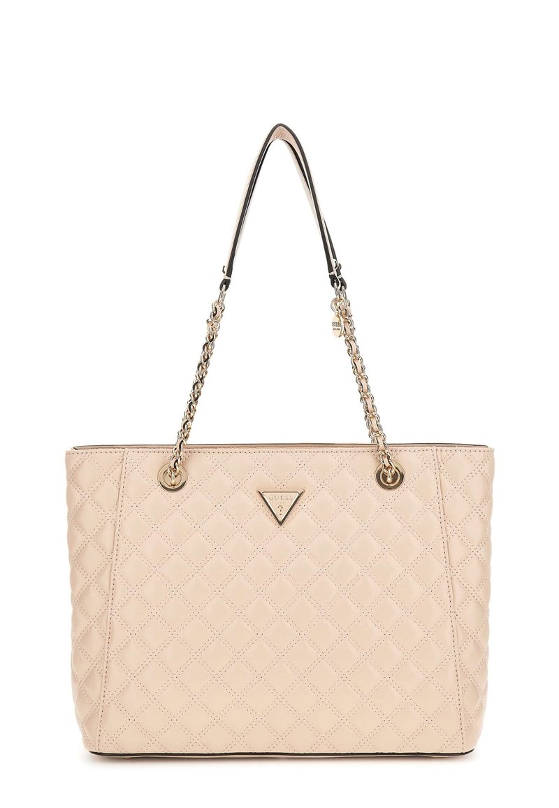 Beige quilted tote bag made of smooth material, featuring gold-tone chain handles and a metal brand emblem on the front.