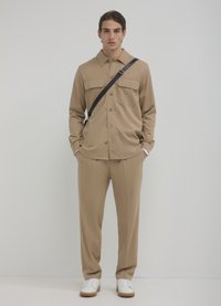 Calliope JOGGER - Stoffhose - beige