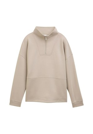 Pull beige avec un col montant et une fermeture éclair demi-longueur, fabriqué dans un tissu texturé, à coupe décontractée et avec des poignets côtelés.
