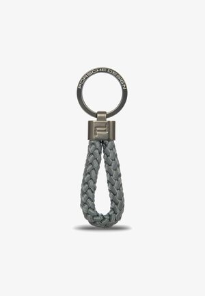Porsche Design sleutelhanger met een gevlochten grijze leren band en een metalen ronde sleutelring met merkdetails.