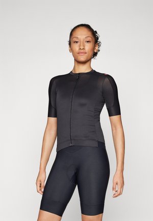 Black cycling jersey with short sleeves and a front zip, paired with black padded shorts. The fabric appears smooth and fitted.