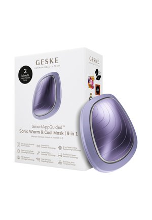 Appareil de masque facial incurvé violet à côté d'une boîte blanche étiquetée « SmartAppGuided Sonic Warm & Cool Mask 9 in 1 » avec des icônes technologiques.