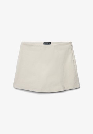 Mini jupe en velours côtelé beige avec fermeture éclair sur le côté et étiquette indiquant "Calliope", en taille small, présentée sur fond blanc.