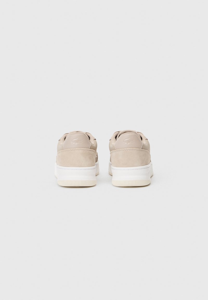 Beige suede and leather sneakers with a white rubber sole, featuring a smooth finish and minimalistic design.