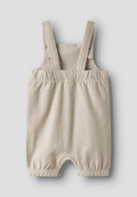 Beige infant romper with adjustable straps, gathered waistband, and elastic cuffs. Made of soft, smooth fabric with a subtle striped pattern.