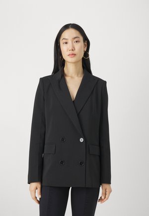 Blazer doppiopetto nero in tessuto strutturato, con rever a punta, due tasche frontali e bottoni. Design minimalista con linee pulite.
