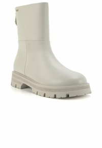 Botte de cheville en cuir gris clair avec une semelle épaisse et texturée, présentant un dessus lisse, des coutures minimales et une languette à l'arrière.