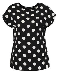 Svart kortärrmad topp med vita prickar, med rund halsringning och en liten bröstficka. Slät tyg med avslappnad passform.