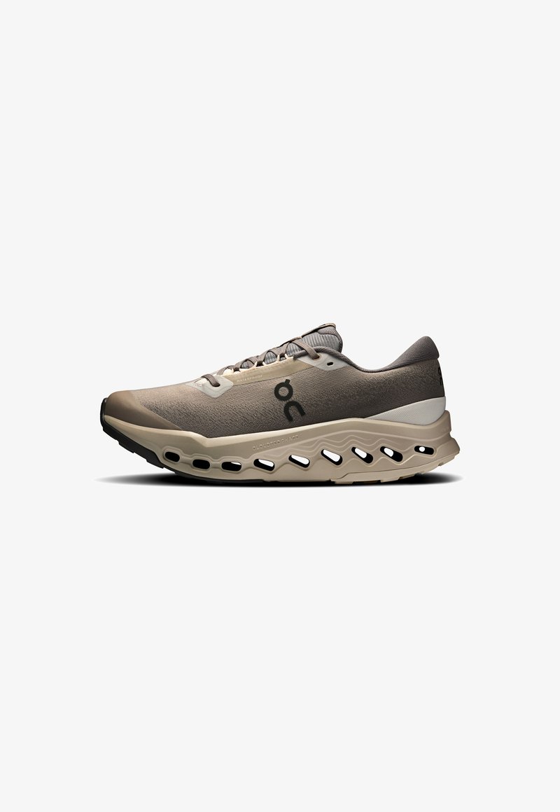 Lightweight running shoe in beige and gray, featuring a breathable upper, textured fabric, cloud-like sole with cutouts, and reinforced toe.