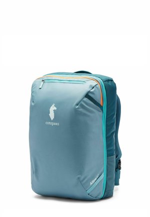 Light blue Cotopaxi Allpa 42 backpack with teal and orange zipper accents, front logo, and padded shoulder straps.