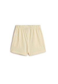 Ljusgula ribbade shorts med elastisk midja, som har en avslappnad passform och slät textur. Lämpliga för avslappnade tillfällen eller sömn.