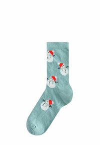 Calzini azzurri chiari con un motivo ripetuto di pupazzi di neve con cappelli rossi. Il tessuto ha un'aspetto morbido e textured.