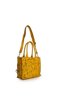 Yellow tote bag made of leather with perforated floral design. Features dual handles and a detachable shoulder strap, accented with metal hardware.
