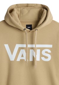 Felpa beige con un grande logo bianco "VANS". Include un cappuccio con cordino e un tessuto morbido e texturizzato. Design semplice e moderno.